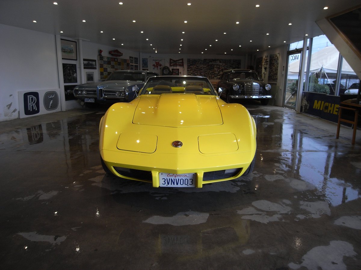 Yellow Chevrolet Corvette C3 in the showroom