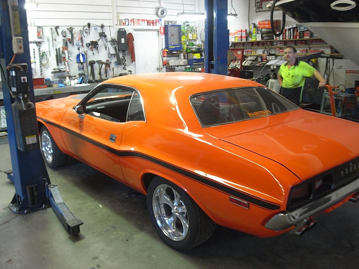 Orange Dodge Challenger in the workshop