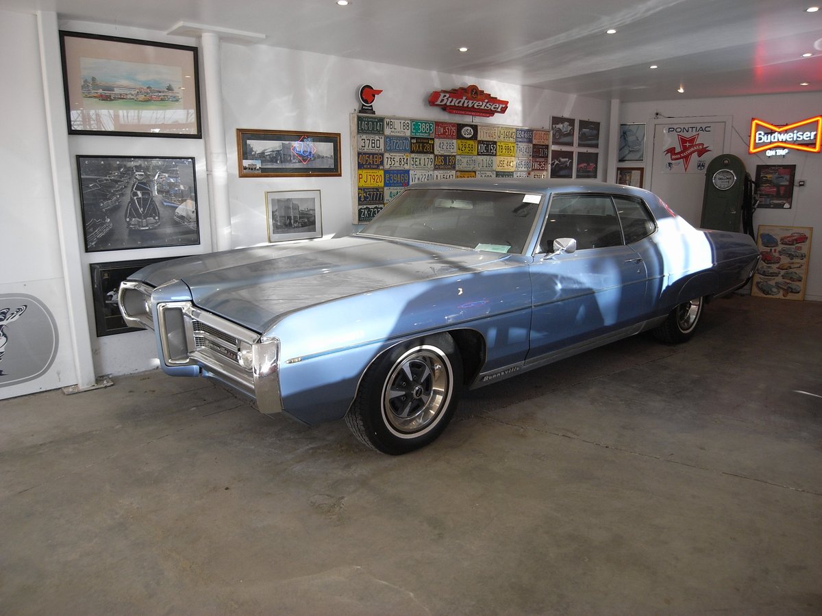 Blue Pontiac Bonneville in the showroom