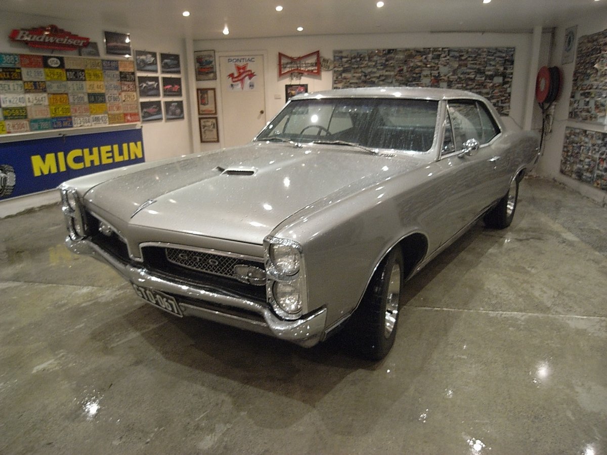 Silver Pontiac GTO in the showroom